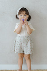 Toddler Girl Wearing Avauma Petit Bloom Rosy Cream Shorts, Lightweight Floral Baby Shorts for Summer